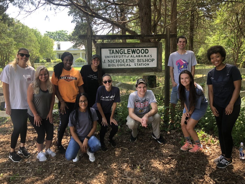 Ecology Lab BSC 386) students posing in front of the Tanglewood Biological Station sign. 